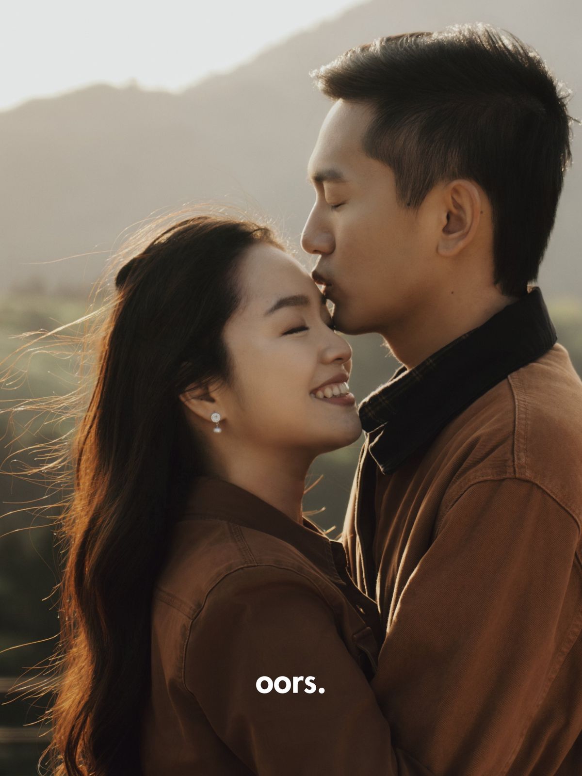 A forehead kiss in golden light