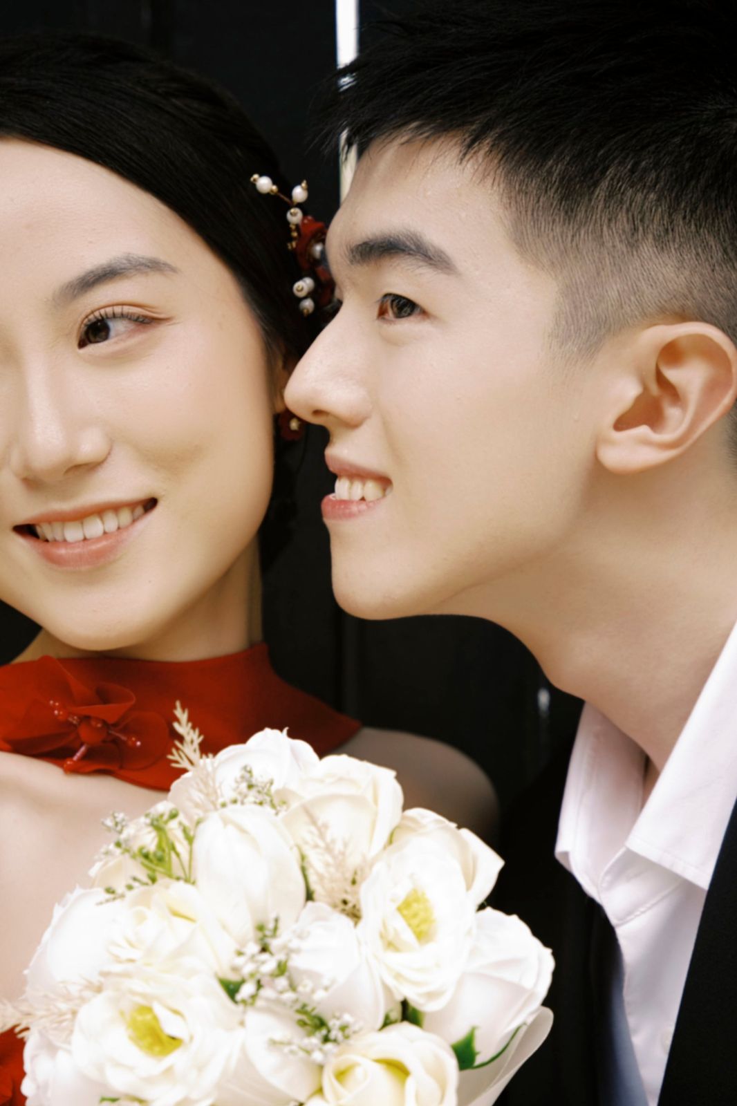 A close-up of the couple, faces turned toward each other