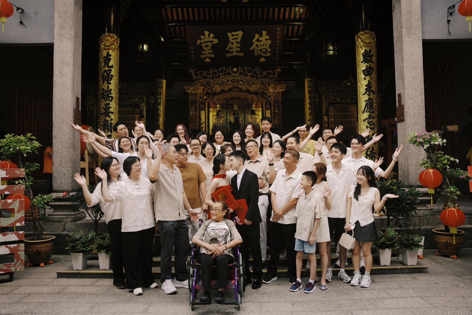 The couple and their families gathered at the entrance of Chan She Shu Yuen