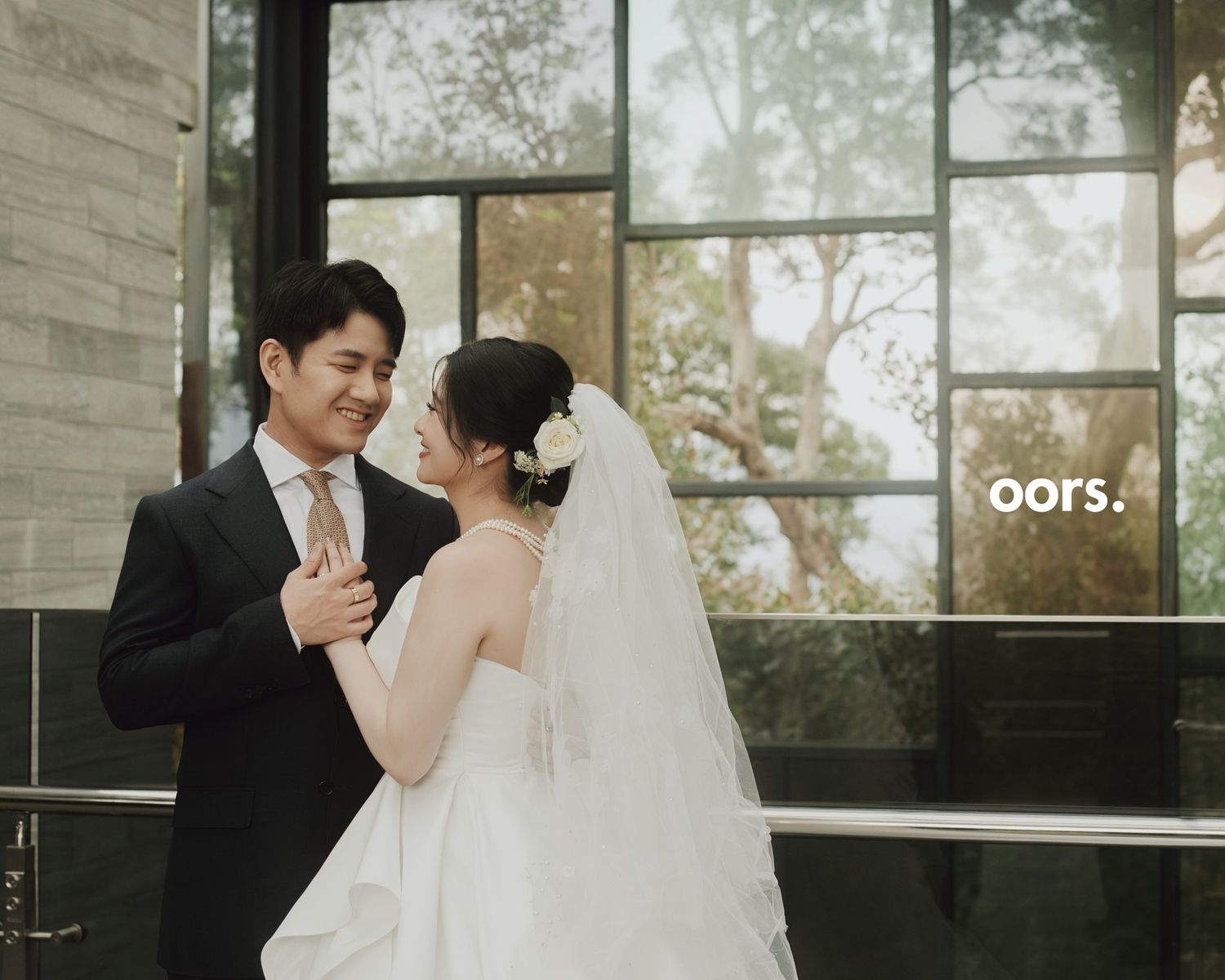 The couple in a quiet moment by the window