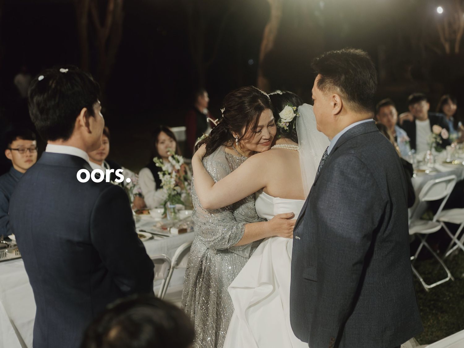 A mother embracing the bride