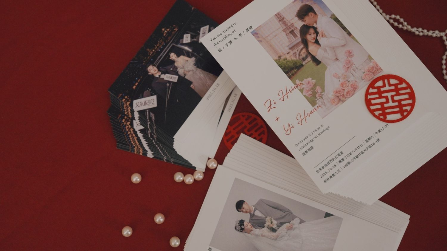 The engagement invitation and pre-wedding cards on red silk
