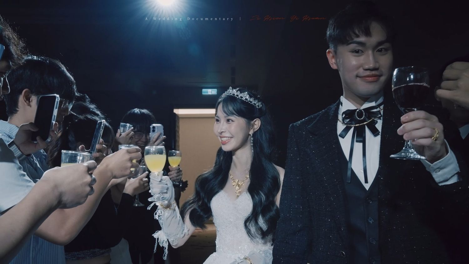 The couple toasting with guests