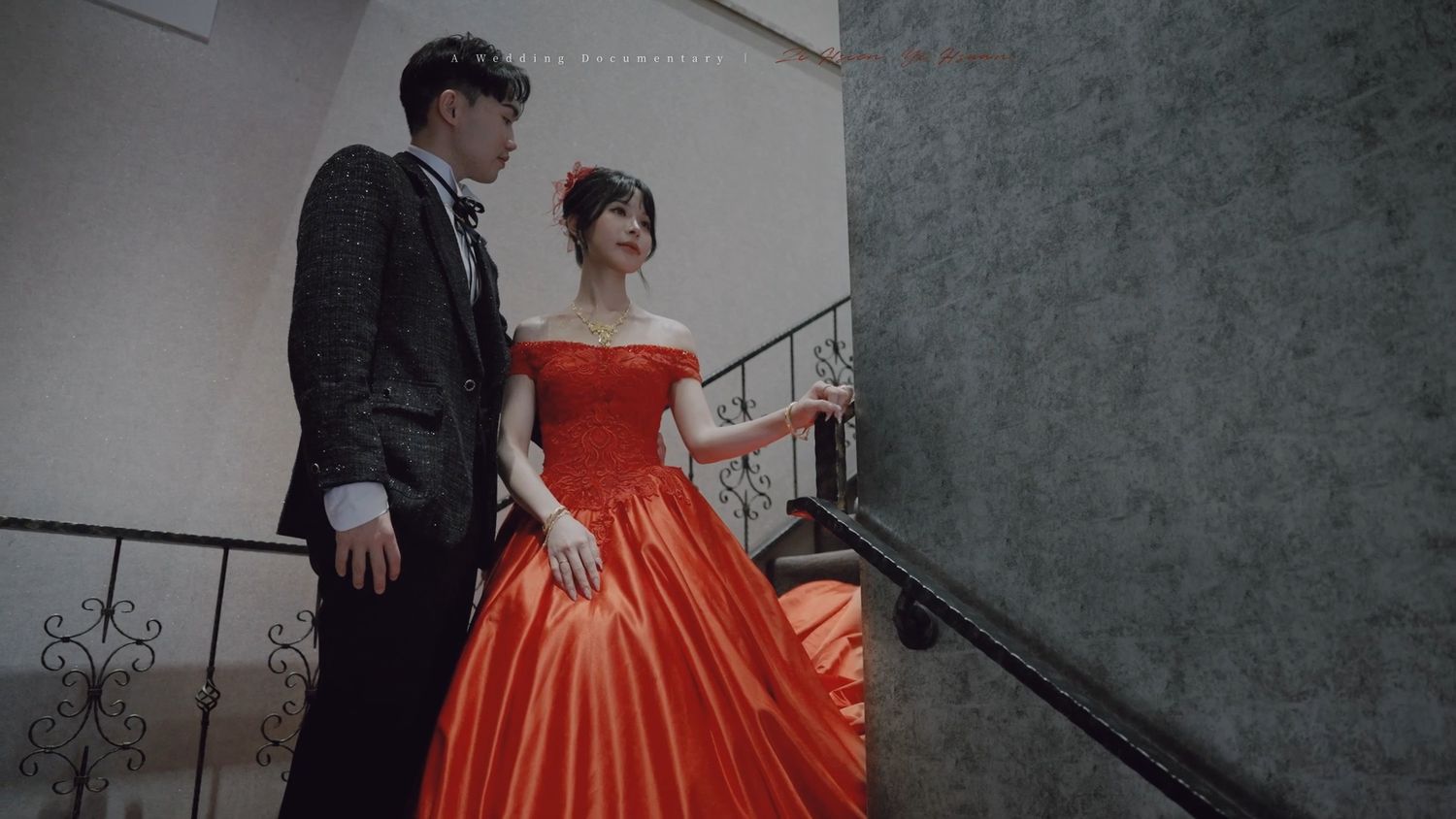 The couple on the staircase in red and black