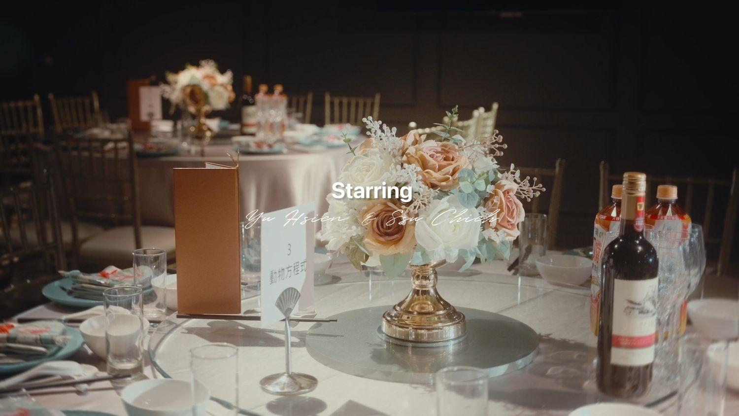 A reception table centrepiece of roses