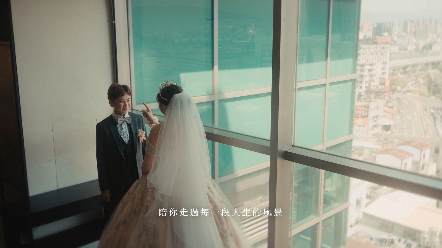 The couple by a tall window